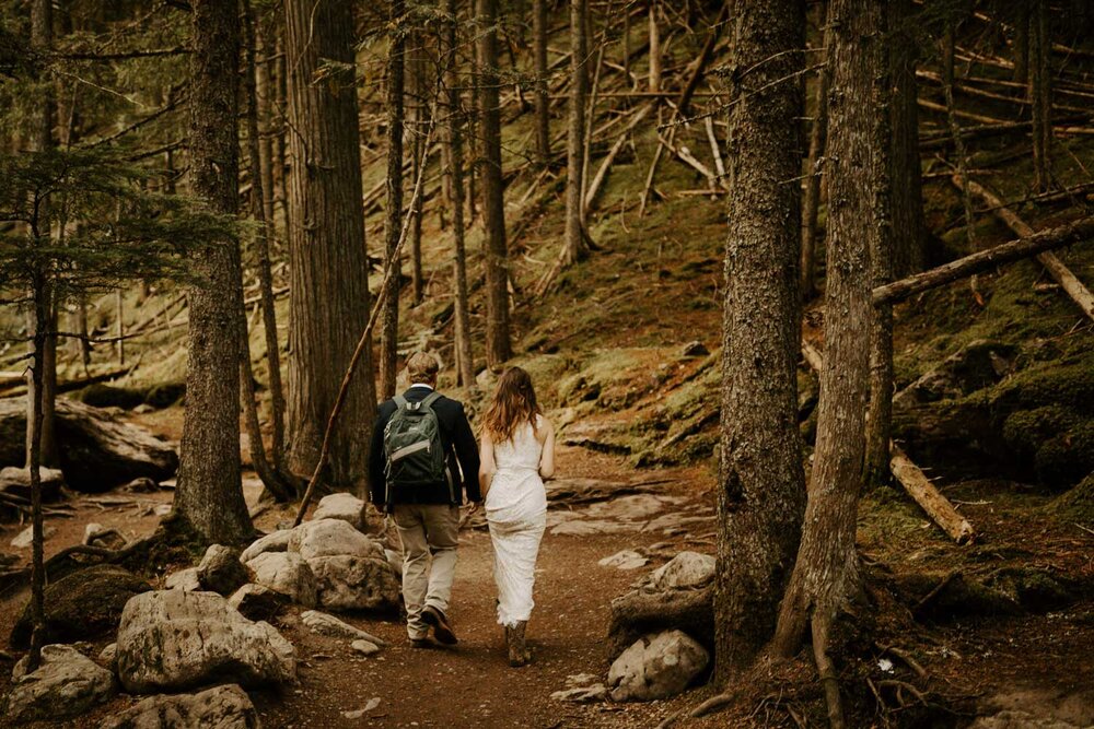 Ali and Tyler-Moss hiking to  Avalanche Lake in Glacier National Park, Montana  on their adventure-filled elopement day.