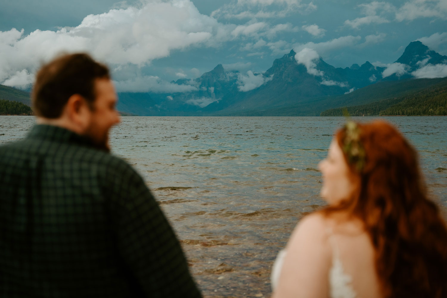 Alex and Katie during their Montana elopement day on the shore of Lake McDonald.