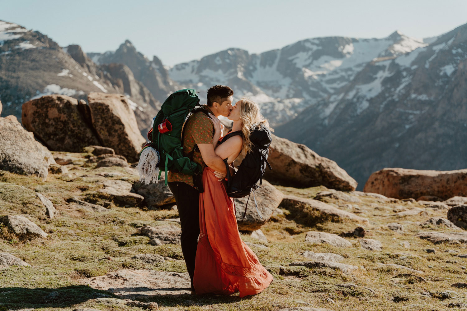 A couple exchanging a kiss in Rocky Mountain National Park.
